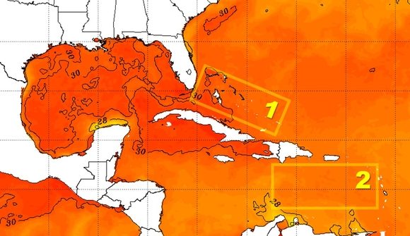 La temperatura superficial del mar en el área de las Bahamas (1) es más elevada que en la parte este del Caribe (2). Imagen: NOAA/NESDIS. La temperatura superficial del mar en el área de las Bahamas (1) es más elevada que en la parte este del Caribe (2). Imagen: NOAA/NESDIS.